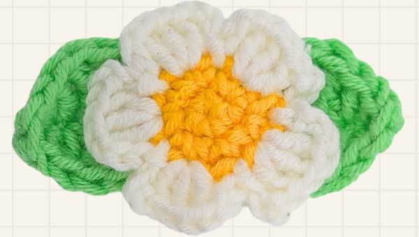 Glue or sew two leaves to the back of each flower.