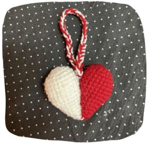 Use a needle to sew the 2 halves of the 2-color heart together