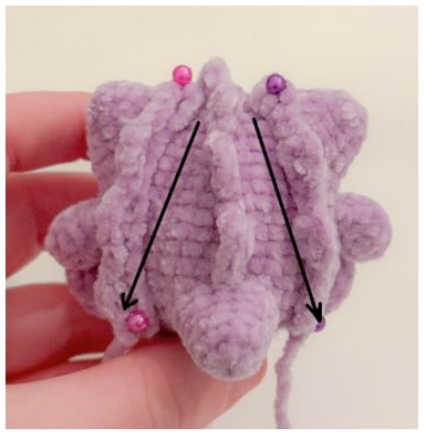 Sew the short spikes directly behind the ears