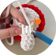 Sc through both sts of the arm and into FLO on the head.